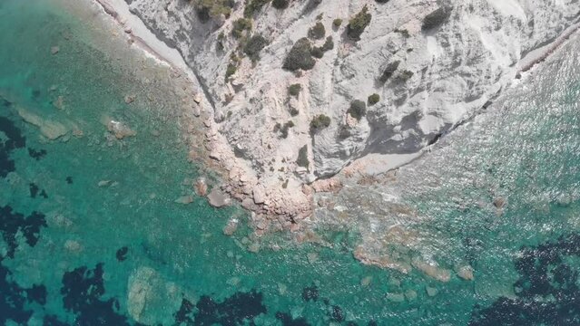 Aerial video of the coastline and rocks on the island of Ibiza, Spain.