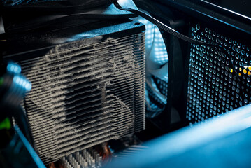 Close-up of a PC cooling system, a dirty radiator from a computer