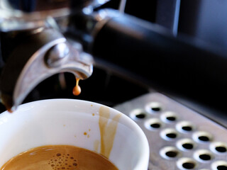 The moment the espresso is extracted