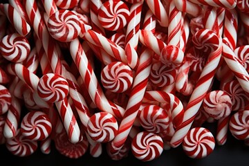  a pile of red and white candy canes with white and red candy canes in the middle of them.