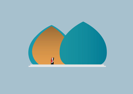 Martyrs Memorial or Al Shaheed Monument with Iraq flag inside, in Baghdad, Iraq