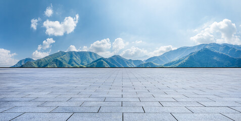 Empty square floor and green mountain nature landscape under blue sky