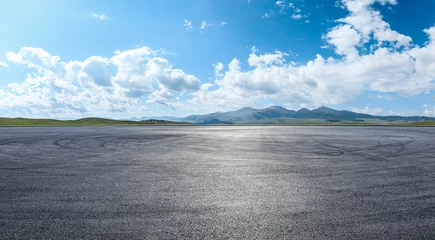 Poster Im Rahmen Asphalt road square and mountain natural landscape under blue sky. Panoramic view. © ABCDstock