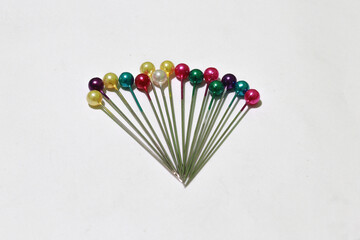 Colorful straight pins isolated on white background