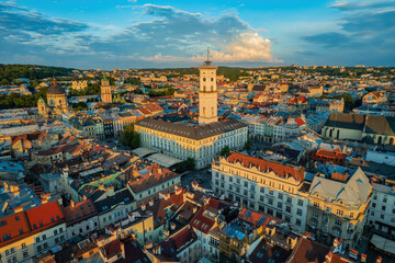 Fototapeta na wymiar Rooftops of the old town in Lviv in Ukraine. The magical atmosphere of the European city. Landmark, the city hall and the main square. Drone photo.