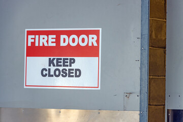 Open fire door with keep closed sign - obrazy, fototapety, plakaty