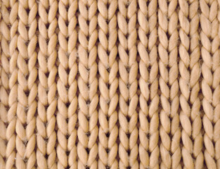 Knitting, sample from beige yarn. Synthetic fibers.