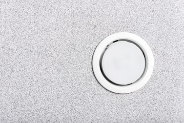 White recessed light in ceiling.
