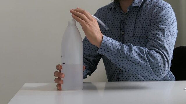 Person using bubble PEP bottle device blowing for asthma and lungs