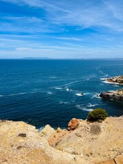 Fototapeta na wymiar Beautiful rocky ocean coast, blue ocean horizon, natural ocean view