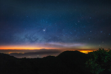Naklejka na ściany i meble Milky way over locating on mountain view between the hiking route to Chiang Dao Wildlife Sanctuary. Chiang Mai province in Thailand.