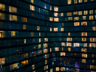 Istanbul's glass and concrete skyscrapers, home to offices, hotels, and residential complexes at night. Aerial drone view