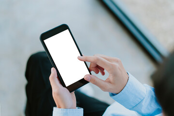 mobile phone mockup white screen space for advertising text copy space hand people using for use. woman hand holding using a cell phone. top view