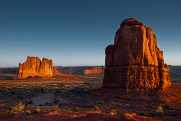 Canyon landscape with rocky sandstone formations at sunset