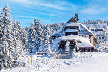 Kopaonik, Serbia ski resort panorama with ski slope, snow covered houses in winter time