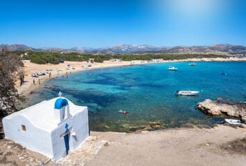 The beautiful beach at Alyko with the small chapel of Agios Giorgis in front, Naxos island,...