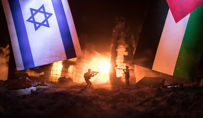 Israel flag on burning dark background with candle. Attack on Israel, mourning for victims concept...