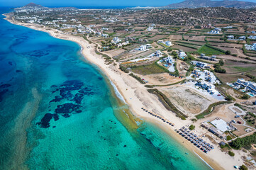 Aerial view of the beautiful Plaka area with sandy beaches and emerald sea at Naxos island, Cyclades, Greece