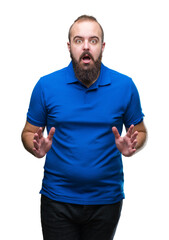 Young caucasian hipster man wearing blue shirt over isolated background afraid and shocked with surprise expression, fear and excited face.