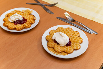 Swedish waffles with berry jam and whipped cream