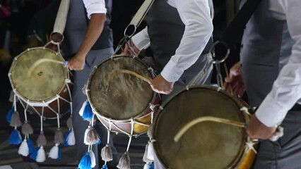 Dynamic trio: Dhol drummers ignite joy at Indian wedding in slow motion.