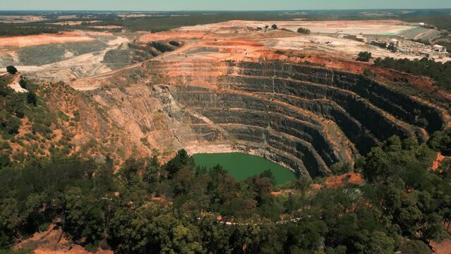 drone shot revealing flooded mine pit in Western Australia