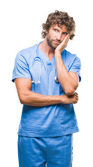 Handsome hispanic surgeon doctor man over isolated background thinking looking tired and bored with depression problems with crossed arms.