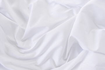 Obraz premium White fabric. luxurious white fabric texture background. Creases of satin, silk and cotton.