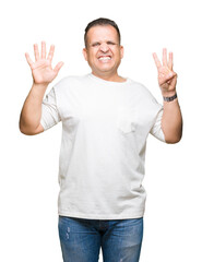 Fototapeta premium Middle age arab man wearig white t-shirt over isolated background showing and pointing up with fingers number eight while smiling confident and happy.
