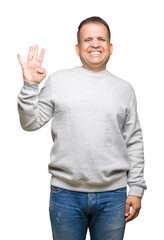 Naklejka premium Middle age arab man wearing sport sweatshirt over isolated background showing and pointing up with fingers number four while smiling confident and happy.