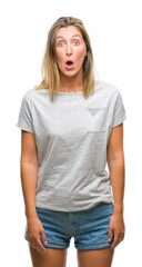 Obraz premium Young beautiful woman over isolated background afraid and shocked with surprise expression, fear and excited face.