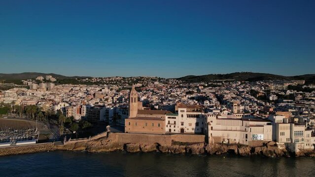 San Bartolome and Santa Tecla Church at sunrise, Sitges town. Aerial view
