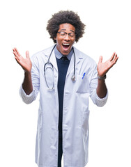 Afro american doctor man over isolated background celebrating mad and crazy for success with arms raised and closed eyes screaming excited. Winner concept