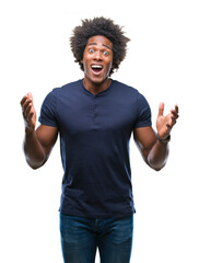 Afro american man over isolated background celebrating crazy and amazed for success with arms...
