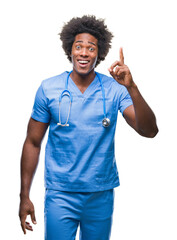 Afro american surgeon doctor man over isolated background pointing finger up with successful idea....