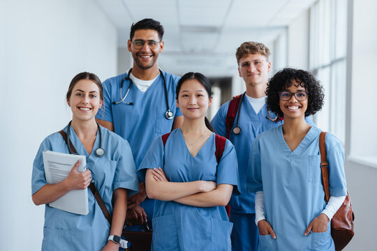 Successful medical team: Healthcare students wearing scrubs on their first day of training