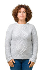 Beautiful middle ager senior woman wearing winter sweater over isolated background Relaxed with serious expression on face. Simple and natural looking at the camera.