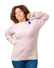 Middle ager senior woman wearing changeable blue color ribbon awareness over isolated background stretching back, tired and relaxed, sleepy and yawning for early morning