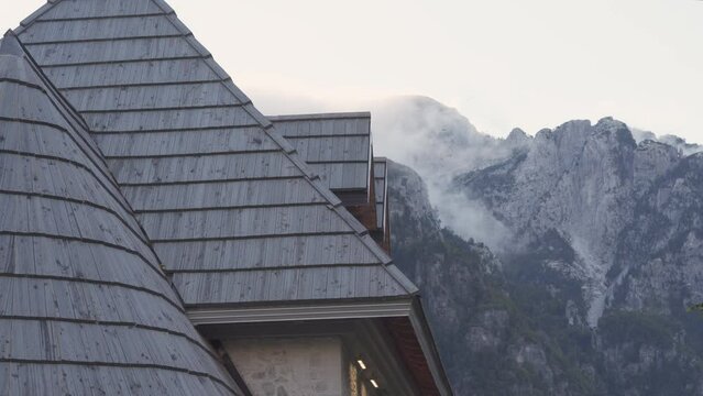 Theth Church Roof and Mountains Background WitRolling Clouds - Static