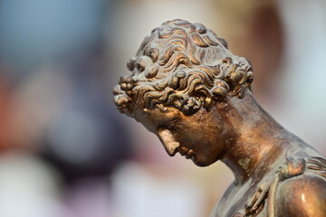 Side view to a roman bronze statue. 