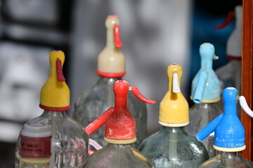 Old soda bottles on a flea market in Spain. 