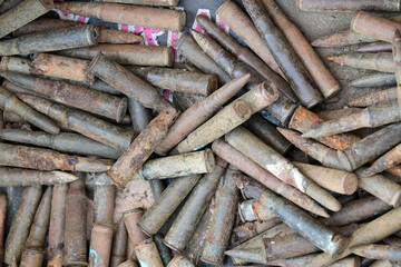 Old, weathered World War II ammunition in a box on a flea market in Spain.
