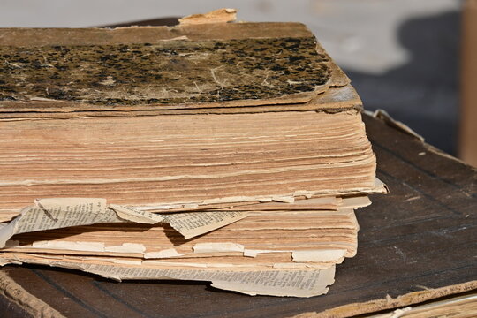 A historic, damaged Spanish book on a flea market in Spain.