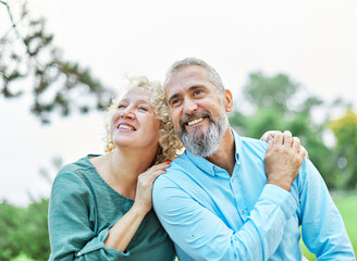 woman man couple happy together hug bonding mature mid middle age aged park outdoor talking leisure fun smiling love old nature wife happiness lifestyle people adult caucasian husband togetherness - Powered by Adobe
