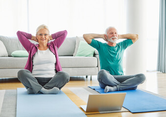  senior stretching exercise woman training lifestyle sport fitness home healthy man couple together pilates gym exercising fit laptop yoga meditation online class instruction