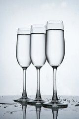 three glasses of water in wine glass