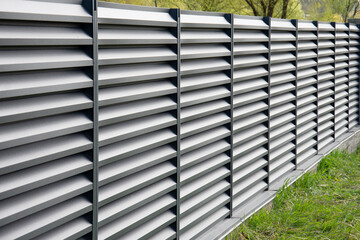Modern metal fence with shutters
