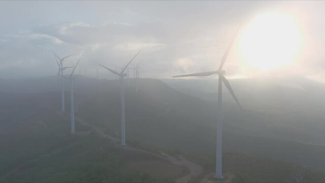 Wind power on misty morning at Grevalosa mountains, Barcelona. Drone flight