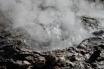 Hot water erupting from a geyser frozen in time. Geysers Del Tatio, Antofagasta, Chile. 