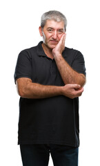 Handsome senior man over isolated background thinking looking tired and bored with depression problems with crossed arms.